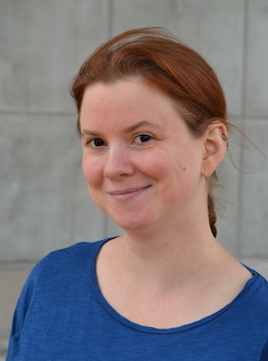 Ester Daniel Ytterbrink in a classical profile photo, taken outdoors,  hair in a braid down the back and a blue tshirt.