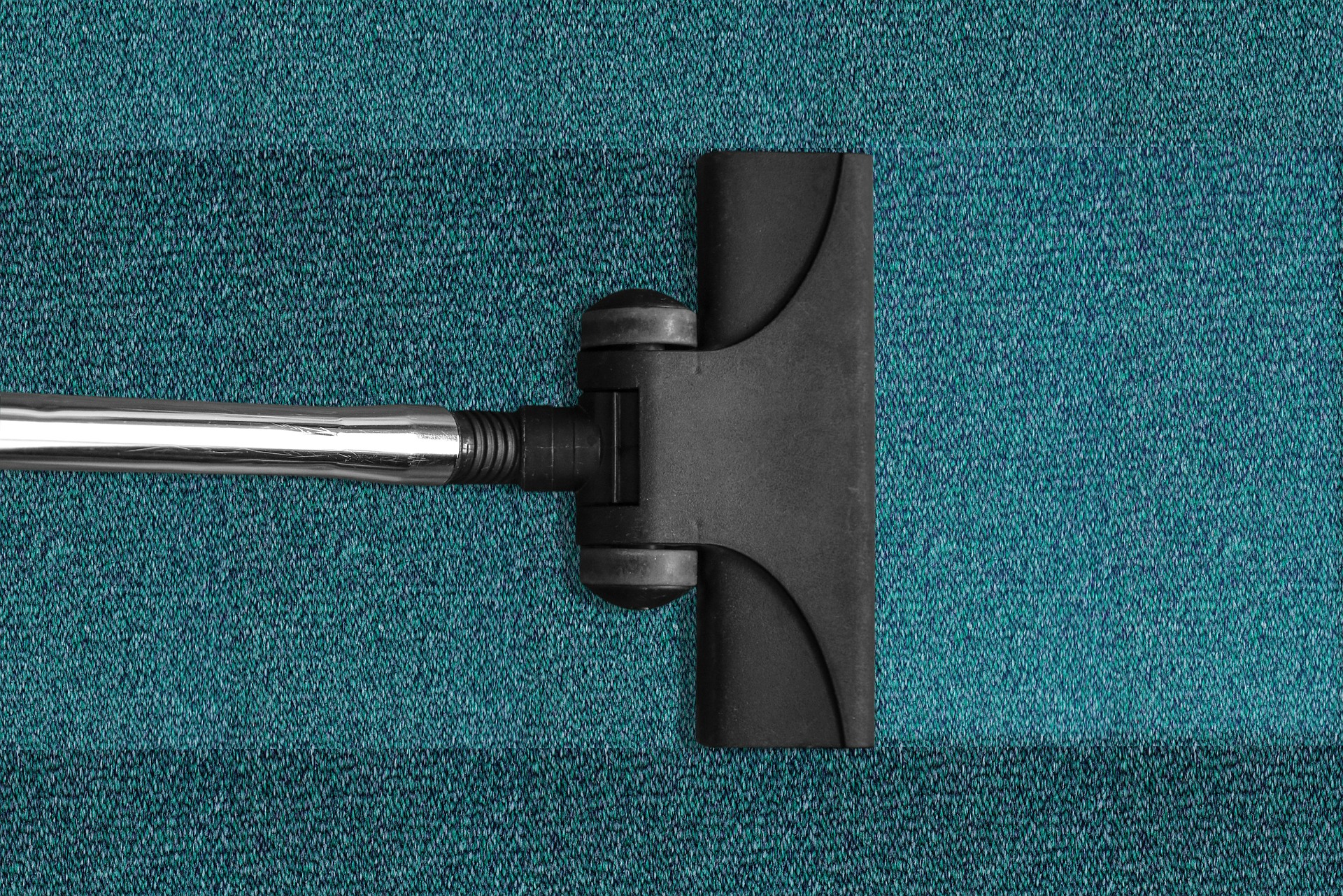 A vacuum cleaner leaving a visible result on a carpet