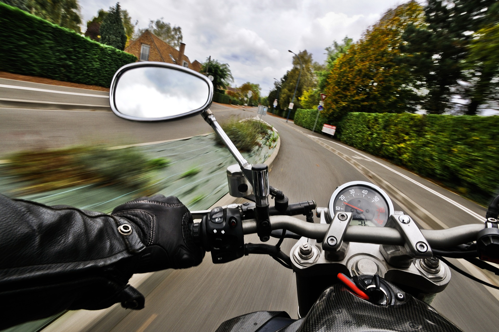 Image by Christel SAGNIEZ from Pixabay A rear view mirror of a motorbike going really fast.